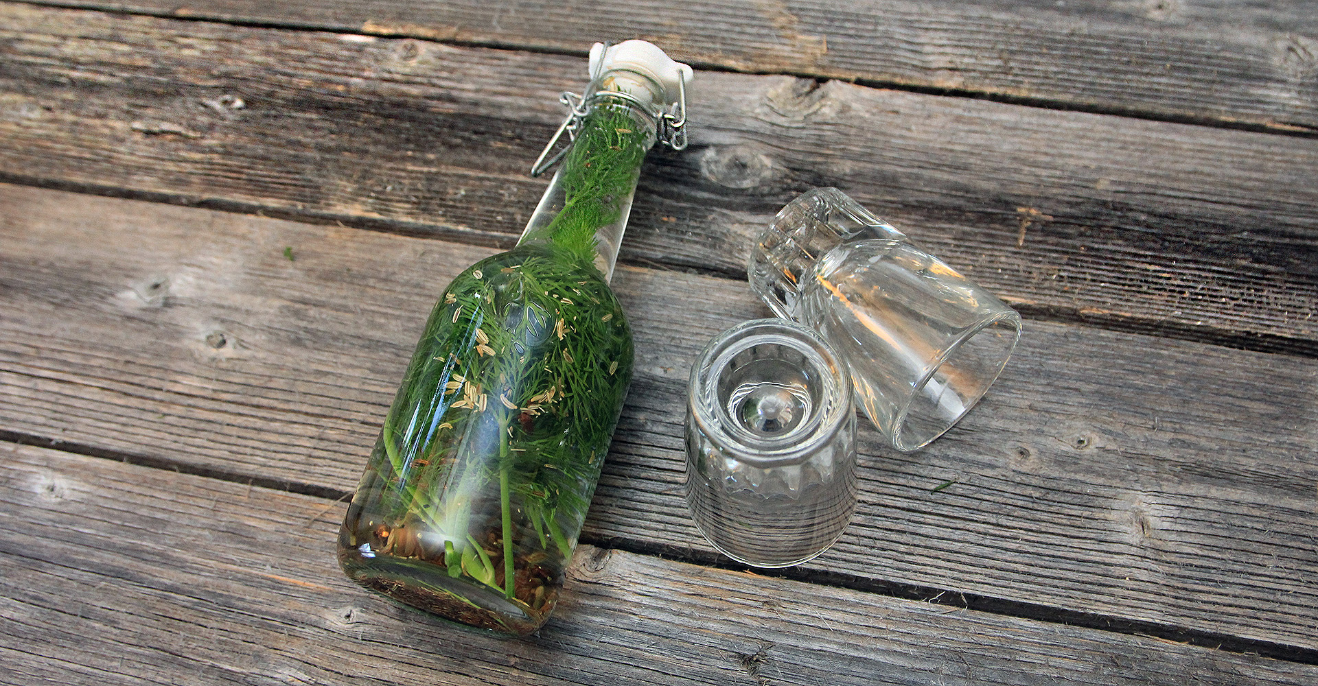 A bottle of aquavit and two shot glasses